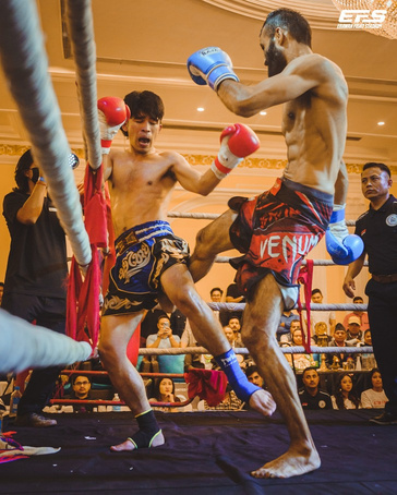 Fighter lands a roundhouse kick